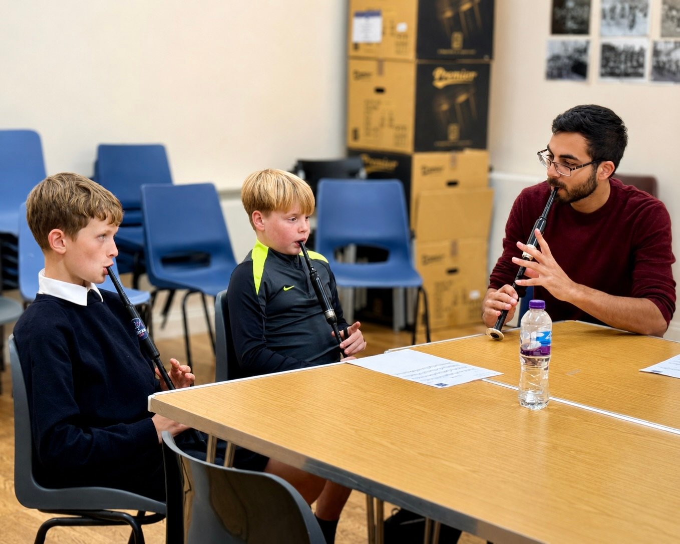 Aaron teaching two pupils
