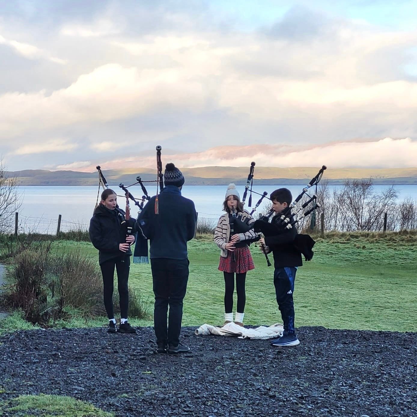 Pioneers performing outdoors at the Tartan Dash