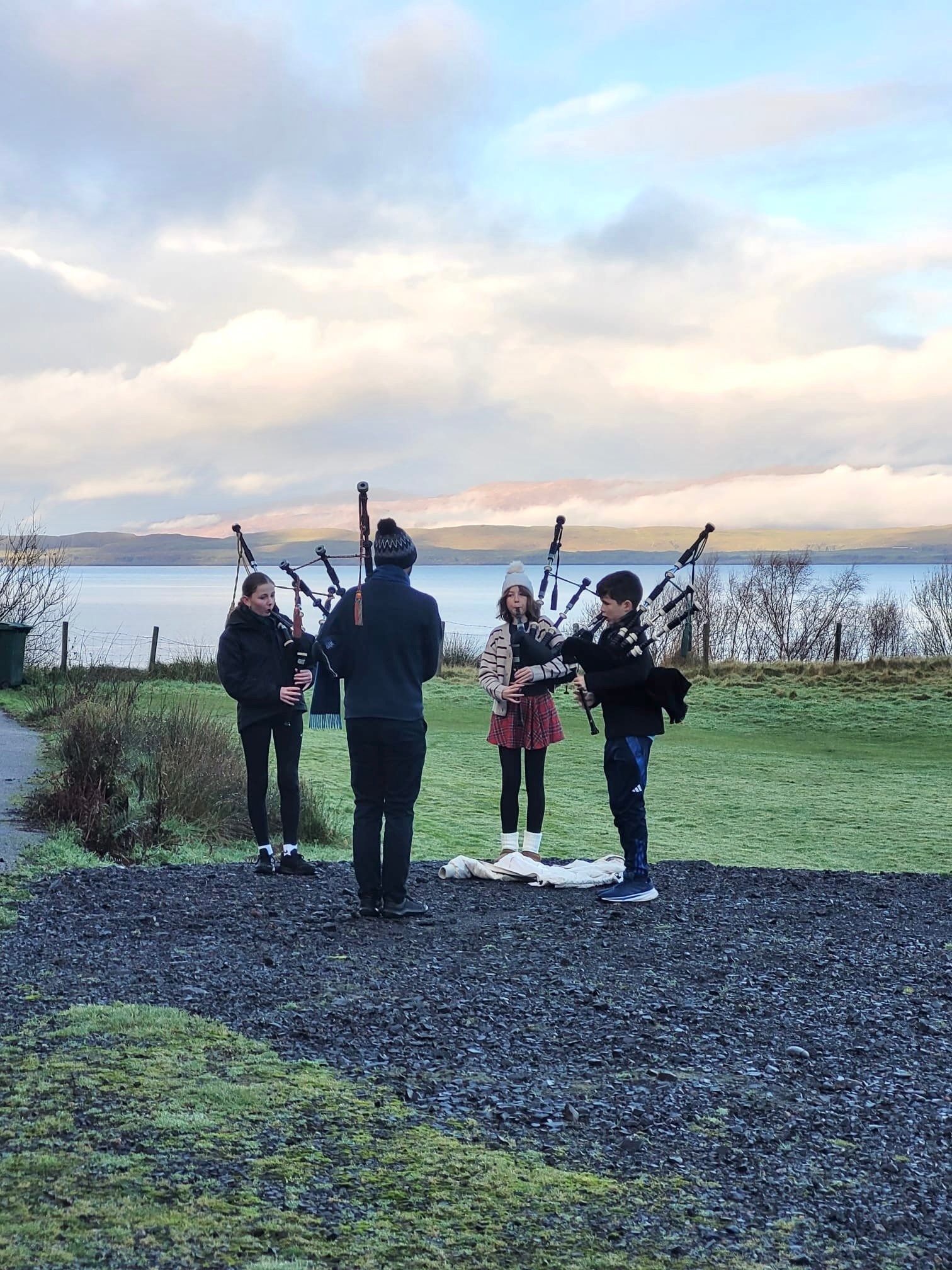 Quartet of new pipers performing for Tartan Dash